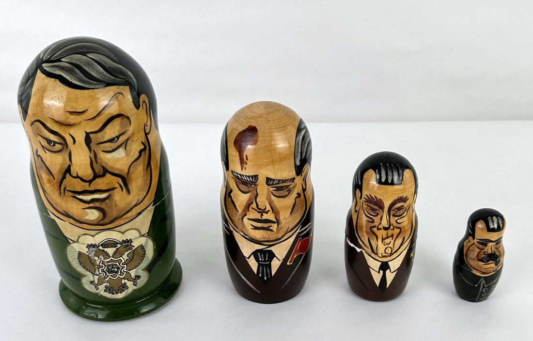 Russian & Soviet Leaders Matryoshka Doll Set: 4 nesting dolls. The largest doll measures 7 1/4" tall by 3 1/2" in diameter.