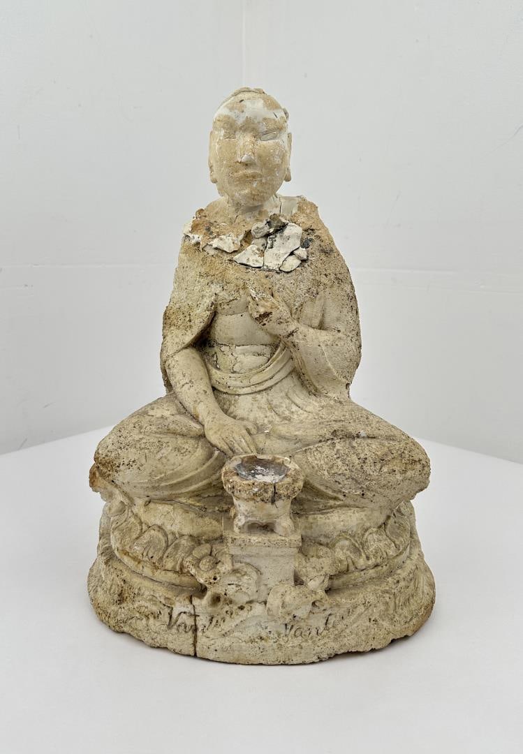 Ancient Chinese Limestone Carved Buddha: Neck appears to have been broken and repaired. There is some writing around the base as shown. Appears to have substantial age. May have been recovered underwater as it has indications of seawater exp