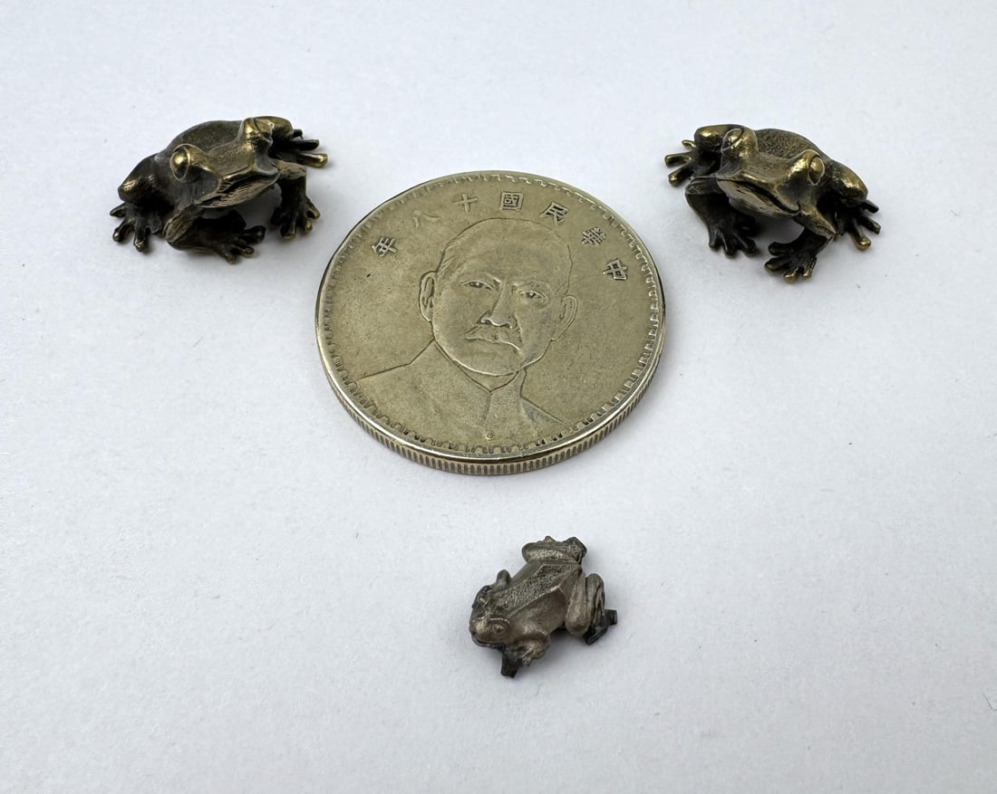 Brass Frogs: Coin is a recast.