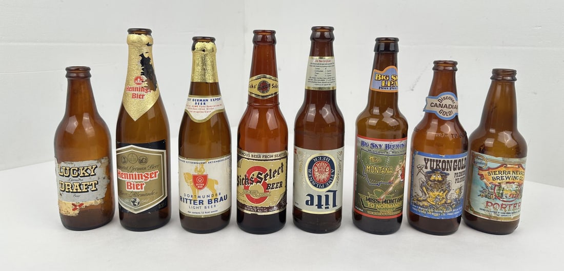 Group of Vintage Beer Bottles: 8 total. Lucky Lager, Henninger, Dortmunder, Sicks Select, and more.