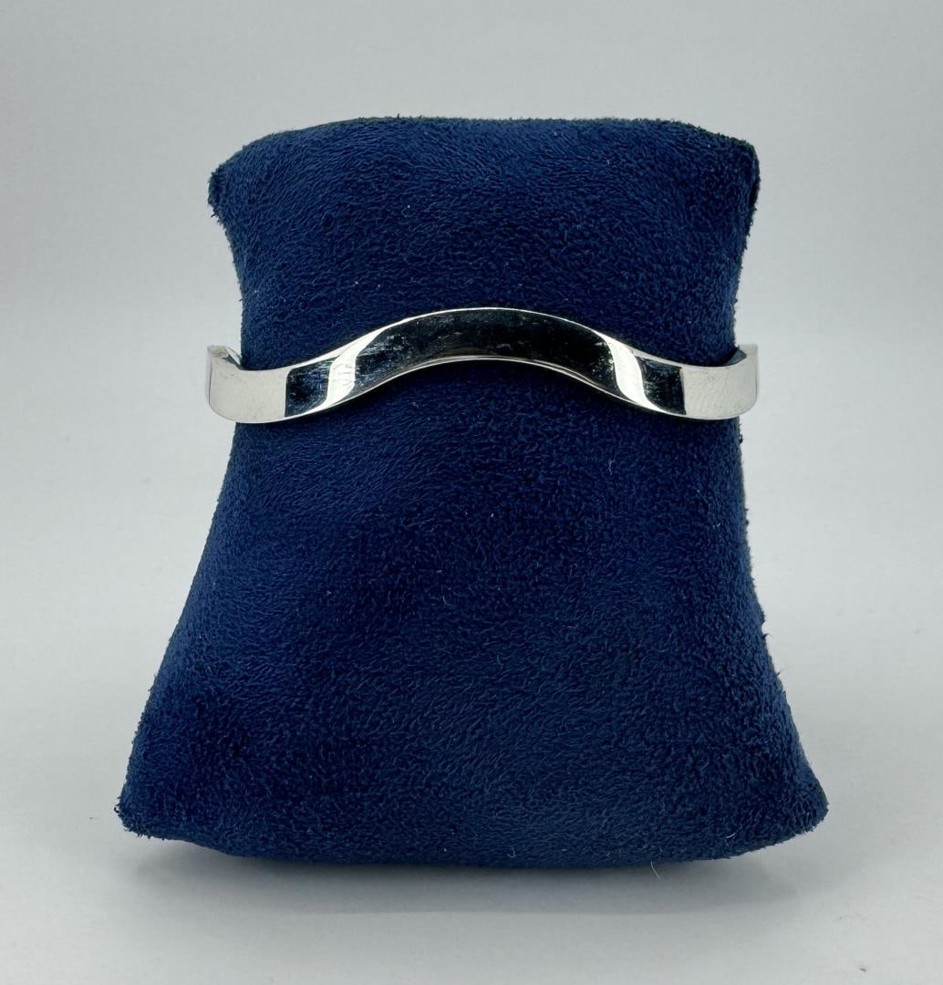 Sterling Silver Clamper Bangle Bracelet: 2 5/8" by 2 1/4".