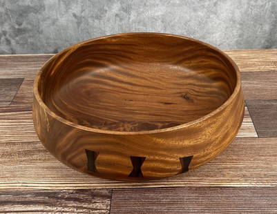 Michael Lee Hawaii Carved Kamani Wood Bowl: 4" tall, 12 1/8" diameter. Mike Lee is Hawaii born and raised, and it shows. An avid surfer and waterman, he gets a lot of the inspiration for his wood carving from the ocean. An excellent and patient