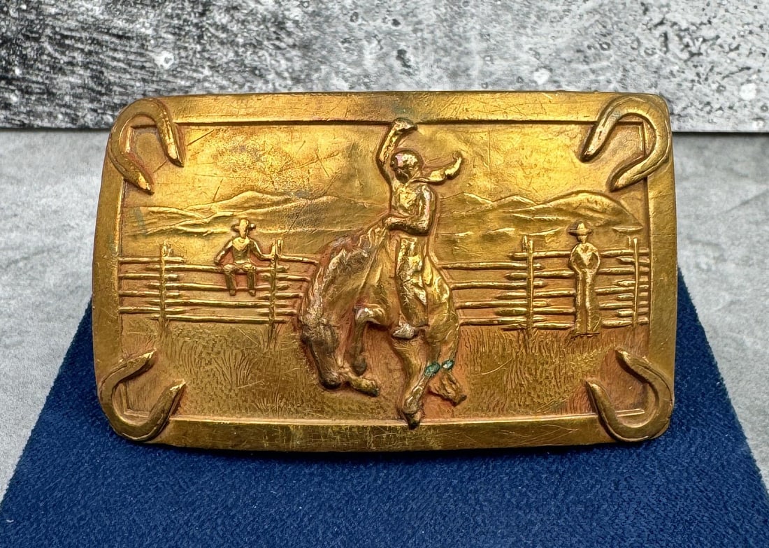 Cowboy Bucking Bronc Belt Buckle: 3" by 1 7/8".