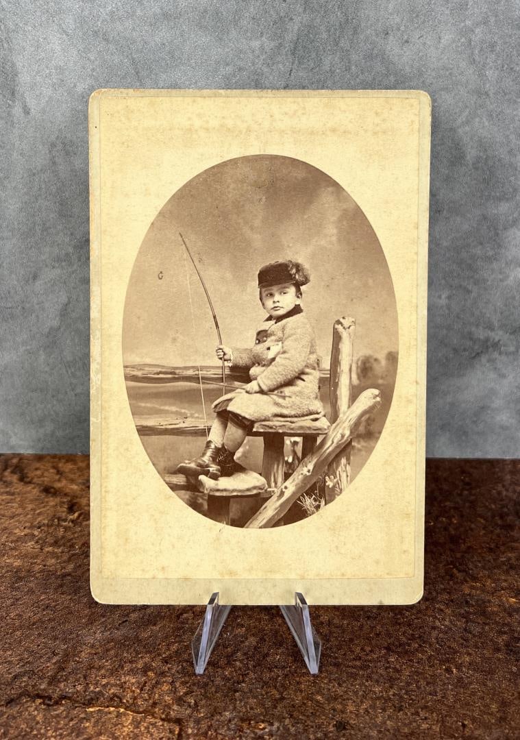 Child with Bow and Arrow Cabinet Photo: 4 1/8" by 6 1/2". Subject is identified on back.