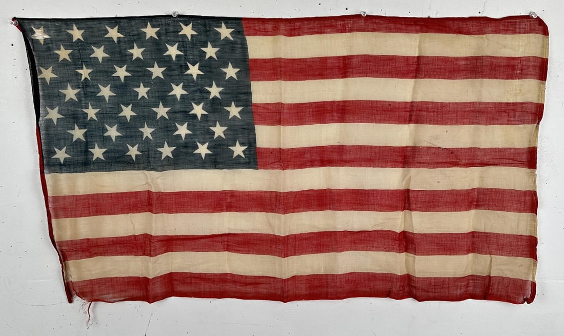 39 Star US American Flag: 33 5/8" by 19 5/8". Circa 1887 -- the Flag that never was. The rare 39-star flag was never an official flag of America. 39 stars is an unofficial count because of the introduction of North Dakota (39)