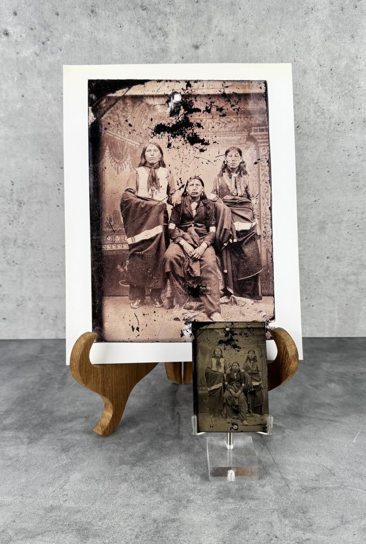 Tintype Photo Native American Chief Goes To War: Photo is of Chief Goes to War and his Sons Chief Hollow Horn Bear and John Hollow Horn Bear. Measures 3 3/4" by 2 1/2". Holed and worn. Includes larger modern blow up of image. PROVENANCE: Martin Lane