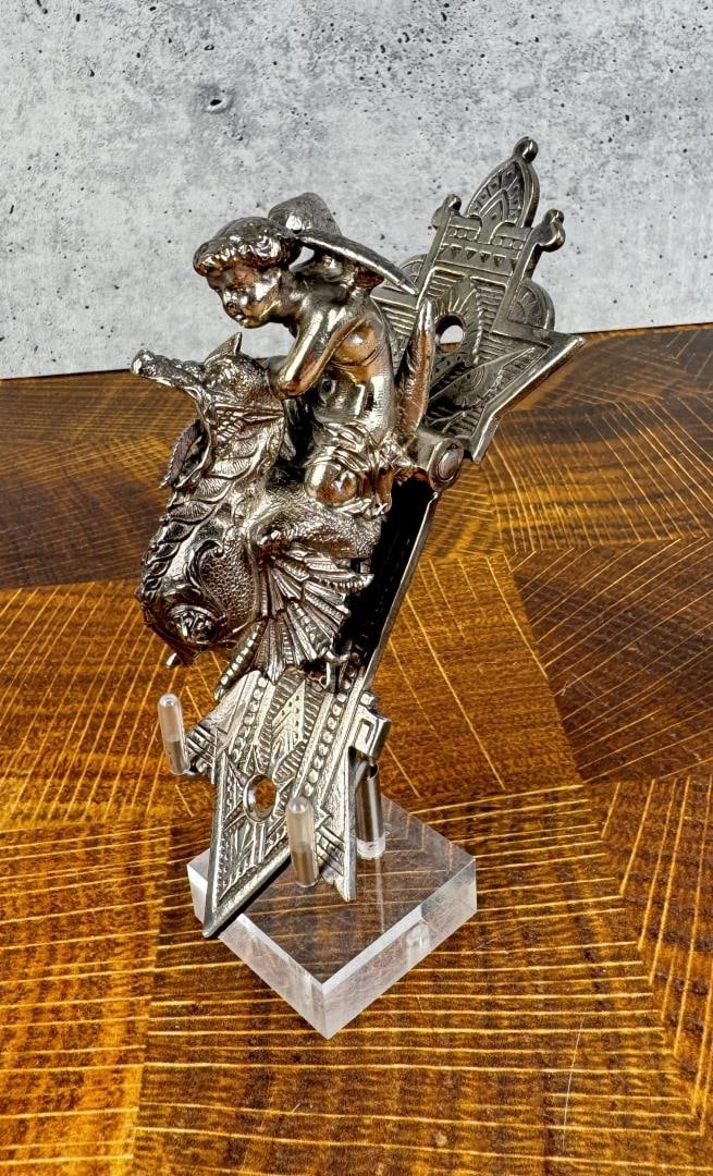 Victorian Eastlake Child on Dragon Door Knocker: 6" long, 2 1/4" wide, 2" tall.