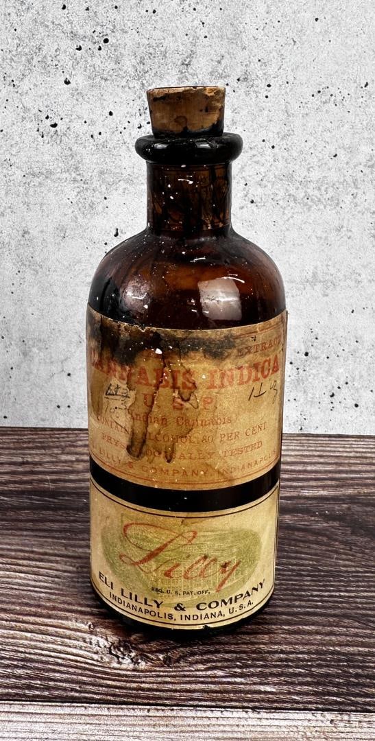 Eli Lilly Cannabis Indica Pharmacy Bottle: Bottle is empty. Hubbard's Pharmacy Polson Montana Estate. 5 1/4" tall.