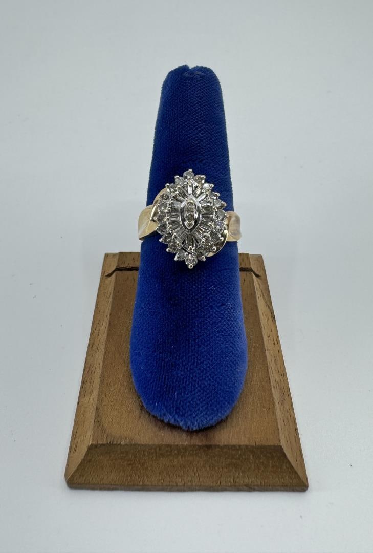 14k Gold and Diamond Ring: 4.19 grams. Size 7.