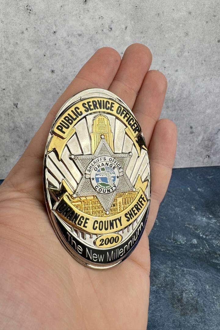 Orange County Florida Sheriff Millennium Badge: Public Service Officer. 3 1/2" by 2 1/4".