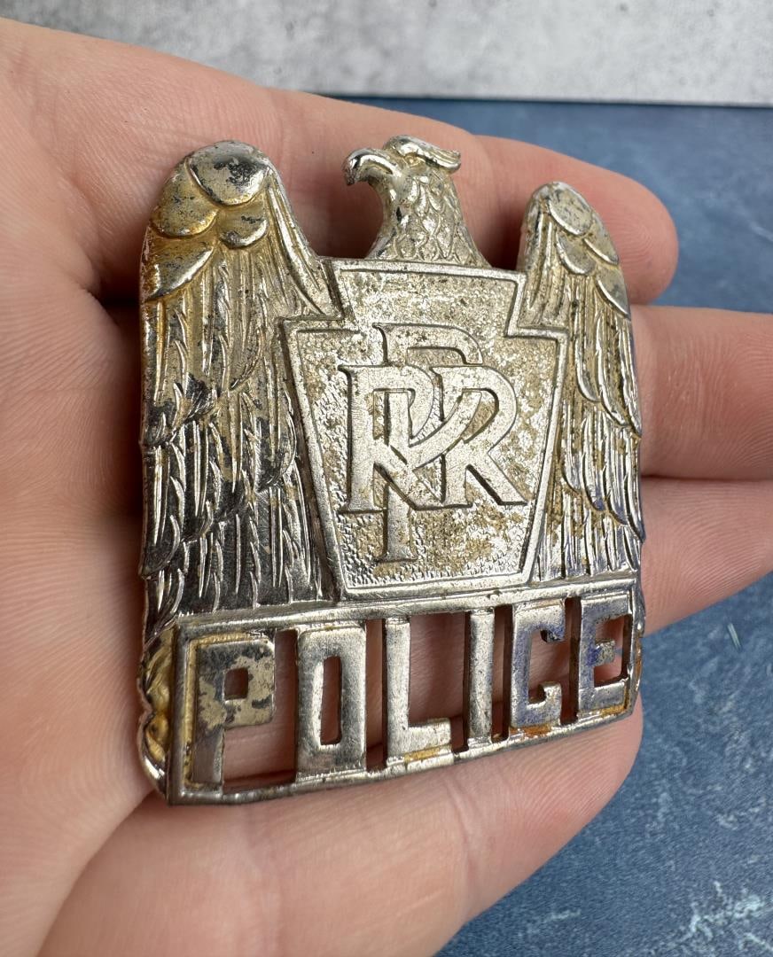 Pennsylvania Railroad Police Hat Badge: 2 1/4" by 1 3/4".