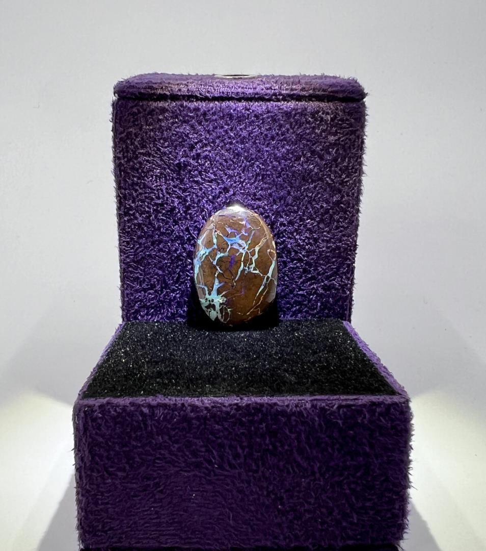 12.6 Carats of Australian Black Boulder Opal: 2.5 grams or 12.6 carats. 3/4" by 1/2".