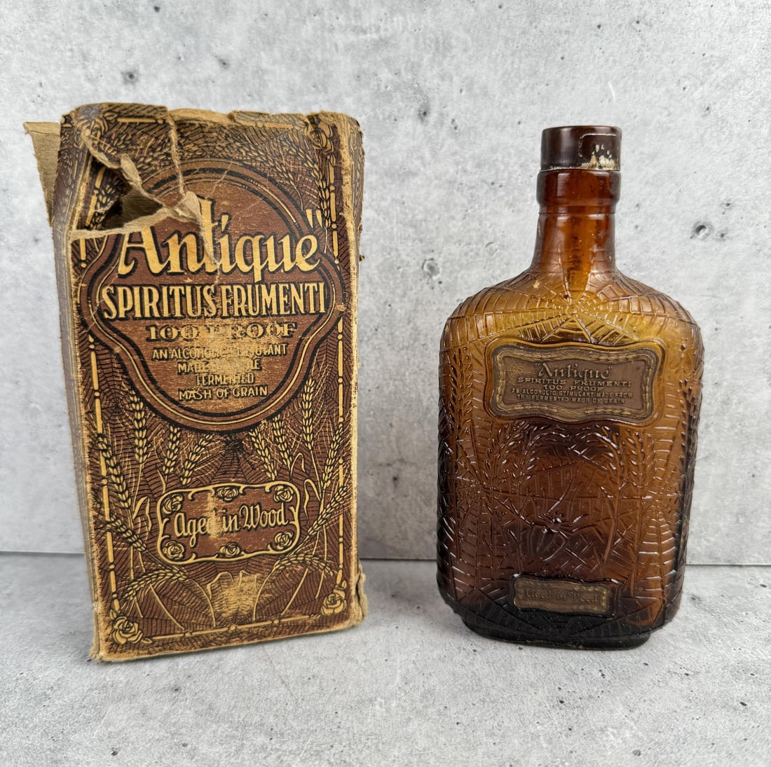 Antique Spiritus Frumenti Whiskey Spider Bottle: Very nice example with labels and original box.