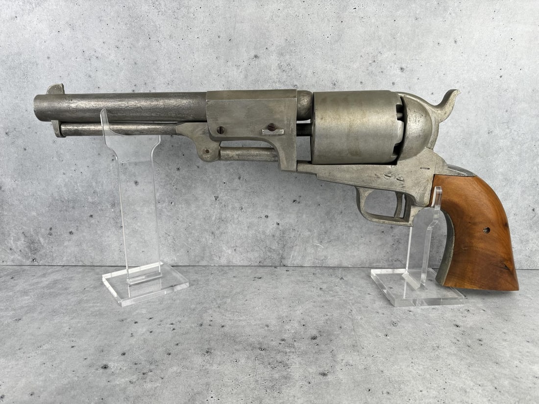 Folk Art Oversized Colt 1848 Dragoon Revolver: Wood and metal. 29 3/4" long by 10 1/4" high by 4" deep. PROVENANCE: Martin Lane Historic & Western Americana Lifetime Collection.