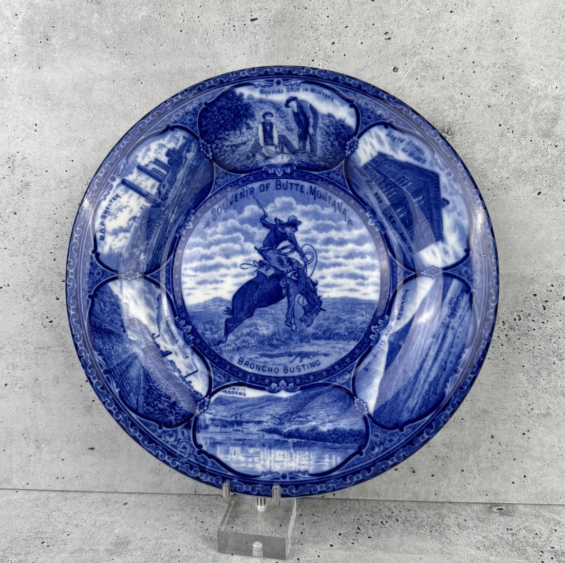 Butte Montana Broncho Busting Flow Blue Plate: 10" diameter. Crazing throughout.