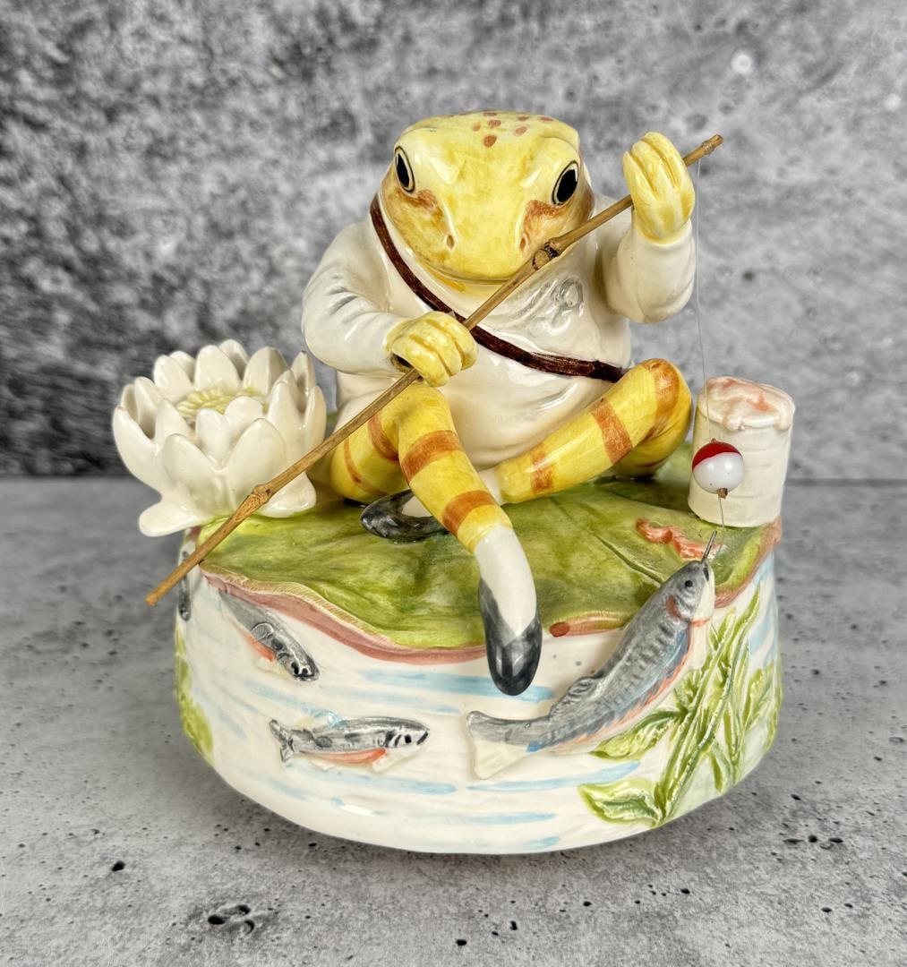 Beatrix Potter Jeremy Fisher Frog Music Box: 4 1/2" tall by 4" in diameter. Working.