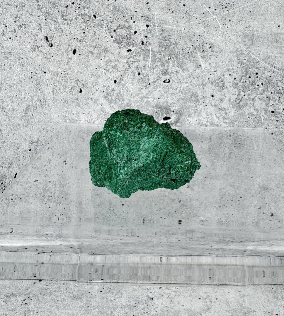 Malachite Cork Ireland Specimen: 1 1/2" by 1 1/8" by 7/8". 28.35 grams. Provenance: From the Estate of Kitty's Copper Shop Butte Montana.