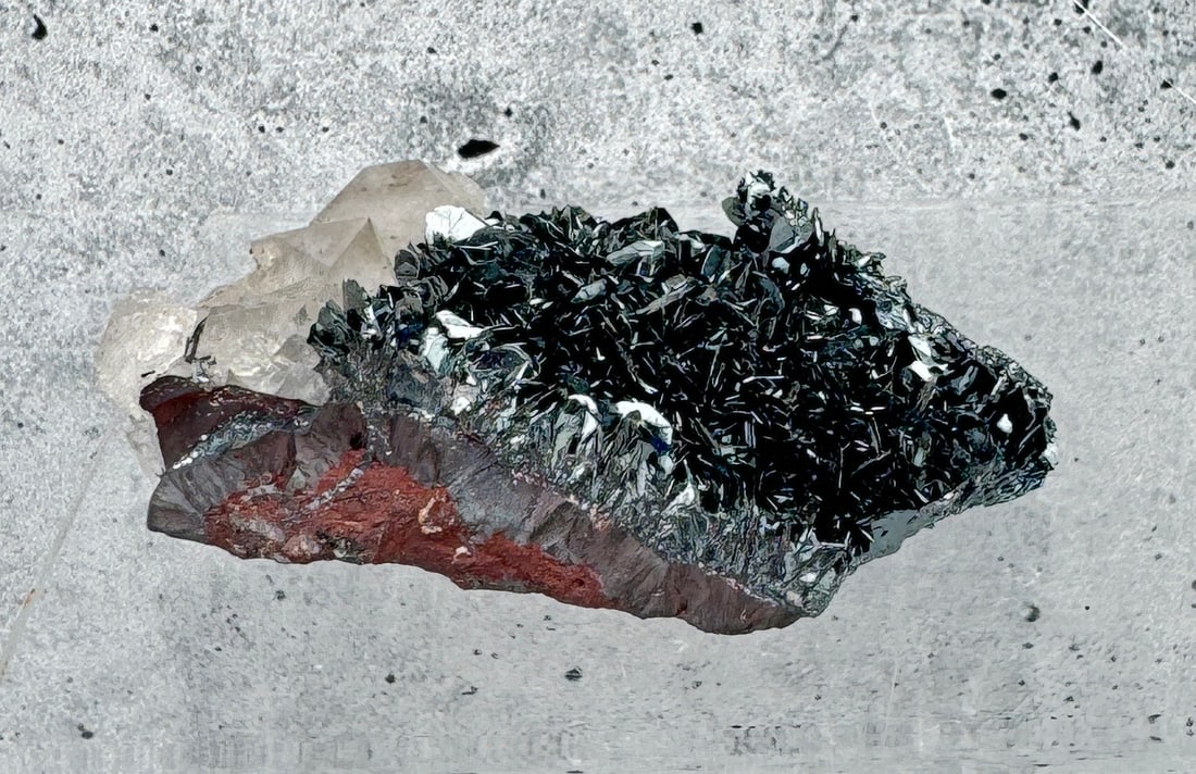 Hematite Crystals on Quartz Specimen: Unknown locale. 2 5/8" by 1 1/2" by 1". 125.1 grams. Provenance: From the Estate of Kitty's Copper Shop Butte Montana.