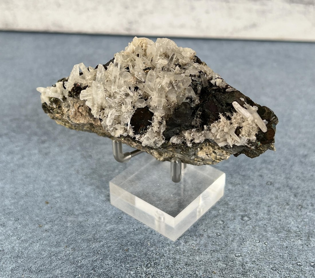 Bornite on Quartz Steward Mine Specimen: 283 grams. 4" by 2 1/4" by 1 3/4". Provenance: From the Estate of Kitty's Copper Shop Butte Montana.