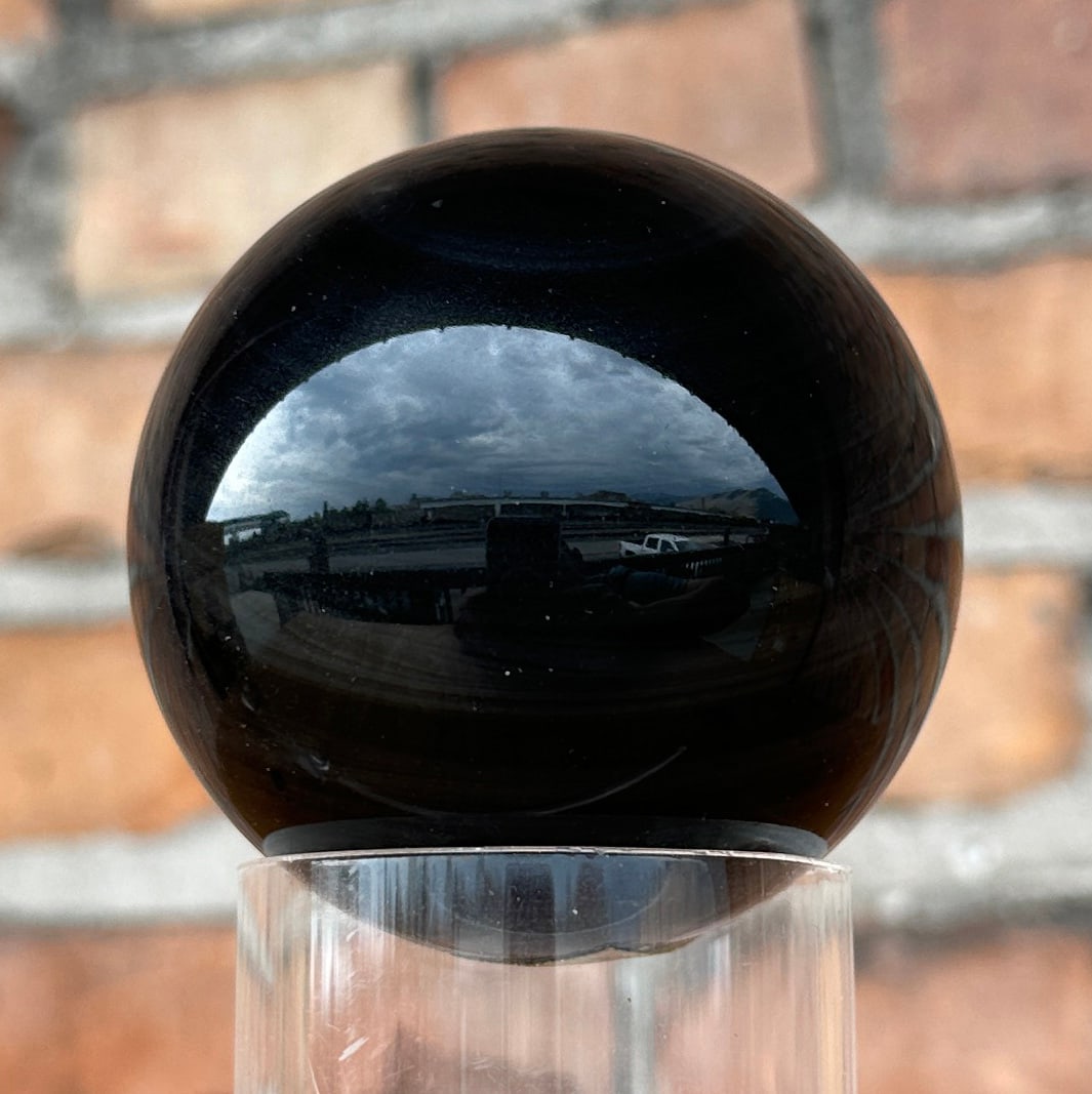 Polished Banded Obsidian Sphere: 409 grams. 2 3/4" diameter. Provenance: From the Estate of Kitty's Copper Shop Butte Montana.
