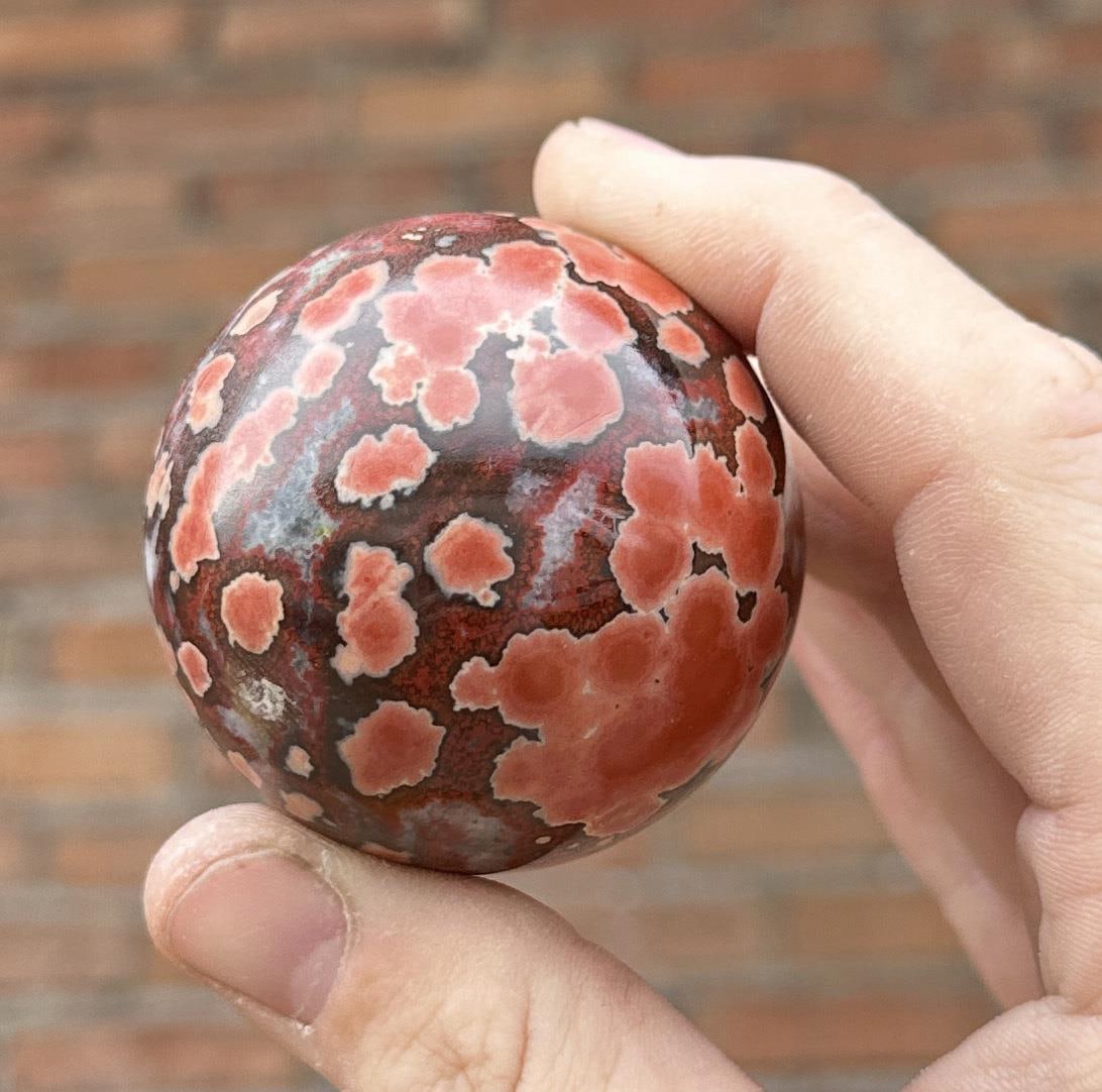 Red Cobra Ocean Jasper Sphere: 2" diameter. 186 grams. Provenance: From the Estate of Kitty's Copper Shop Butte Montana.