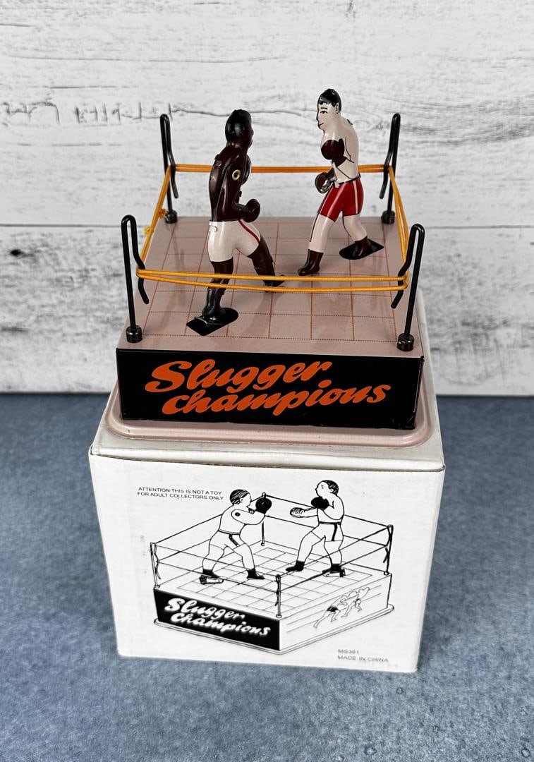 Slugger Championship Tin Wind-Up Toy: Contemporary tin toy with box. 5 1/4" by 5 1/4".