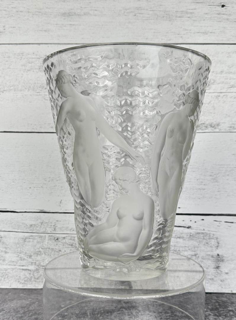 Lalique Ondines Bacchantes French Crystal Vase: Bottom signed R. Lalique France. 9 1/4" tall by 7 1/2" in diameter.