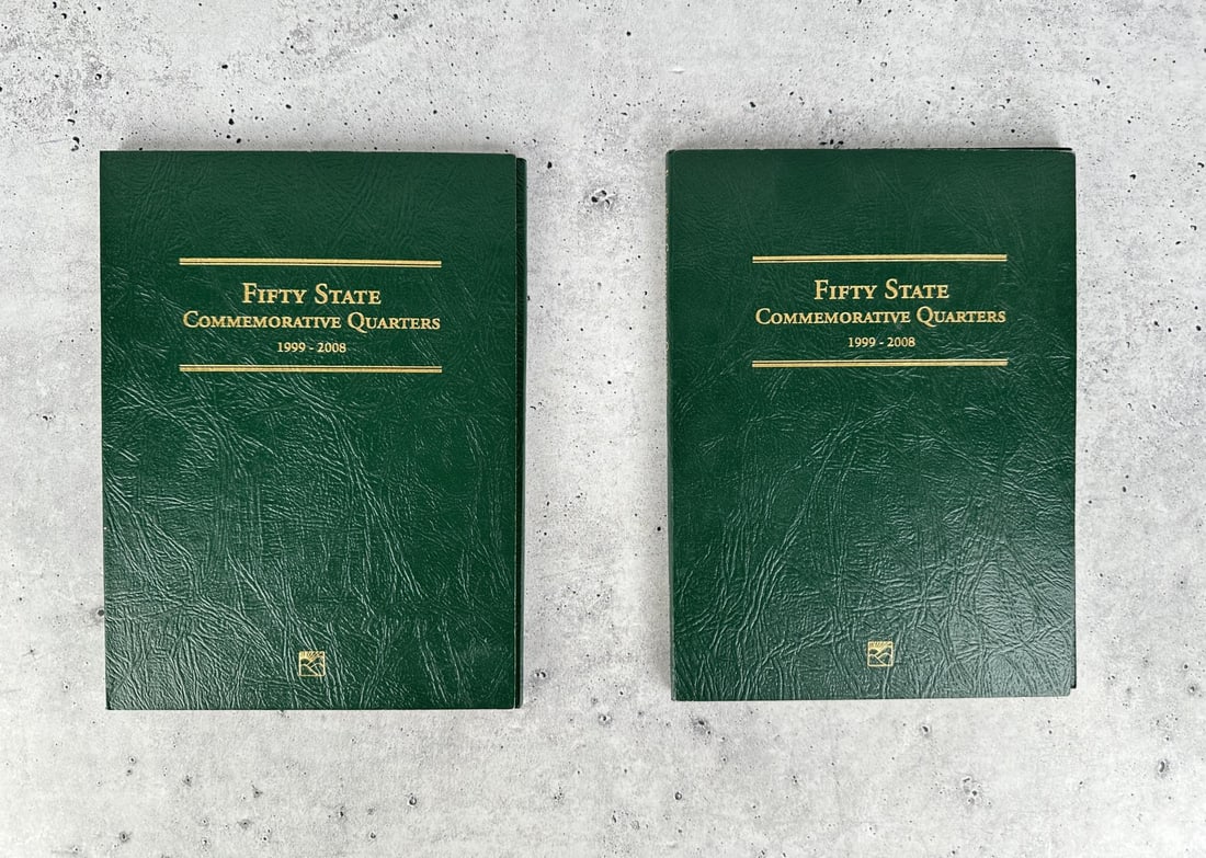 50 State US Quarter Collector Books: Two books containing 103 total quarters.