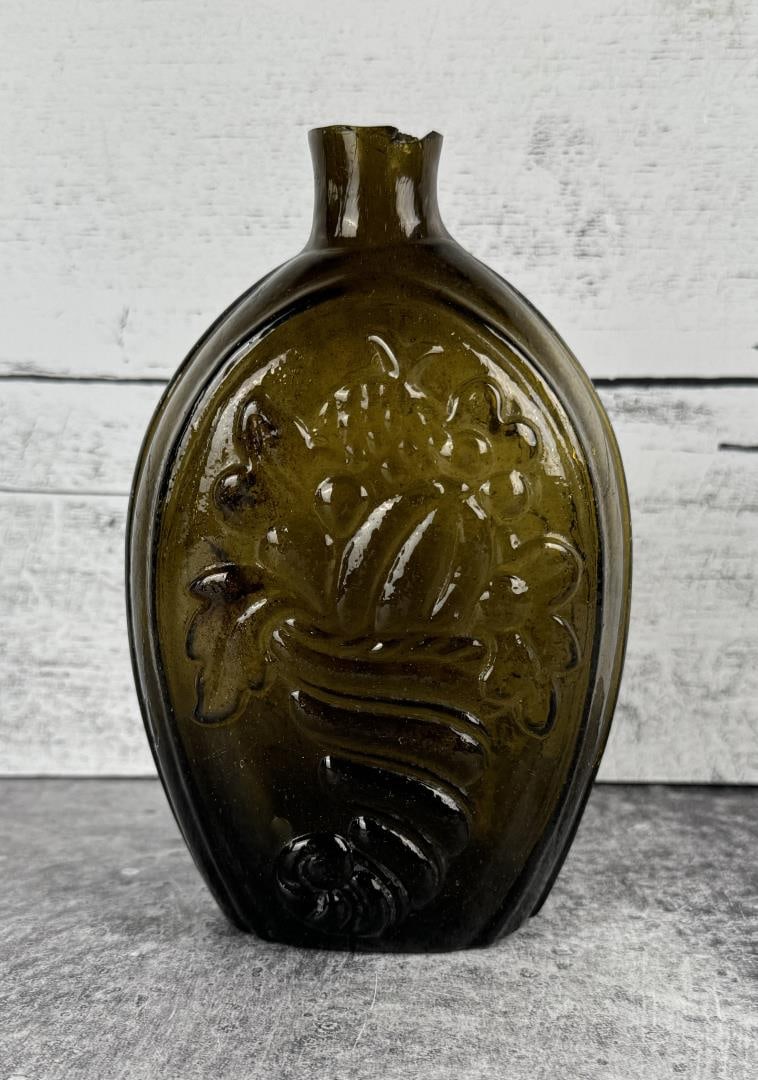 Historical Cornucopia Urn Pictorial Flask Bottle: Coventry Glassworks 1815-1848. 6 3/4" tall by 4 1/4" wide by 2 1/4" deep. Lip damage as shown