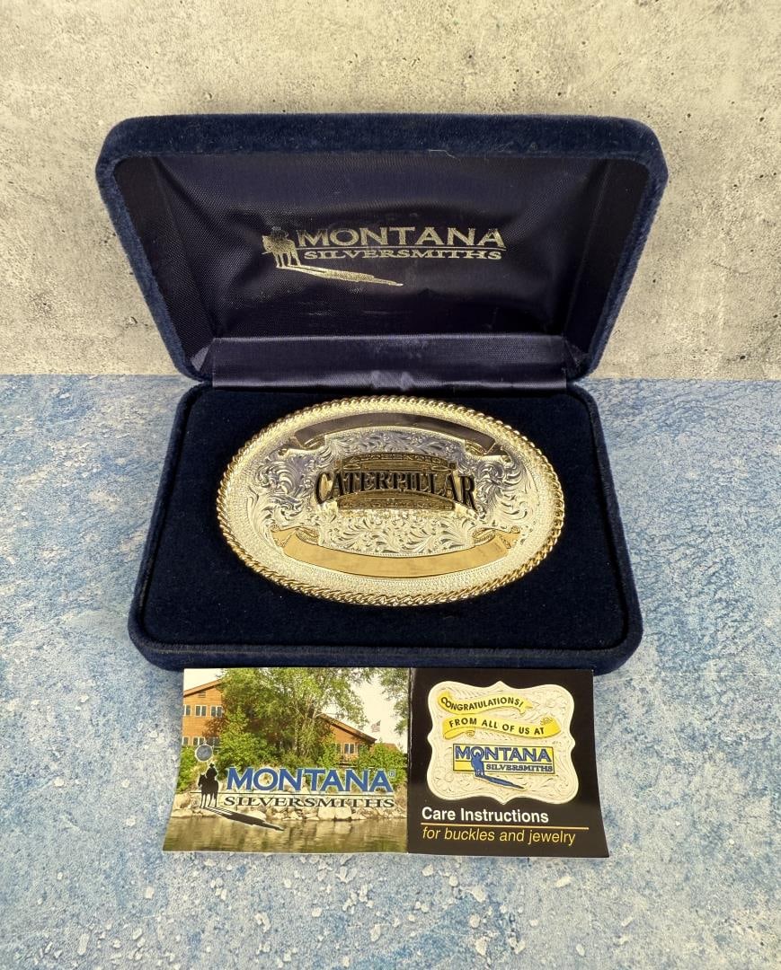 Montana Silversmiths Cowboy Belt Buckle: Caterpillar Tractors. 2 1/2" by 3 5/8".