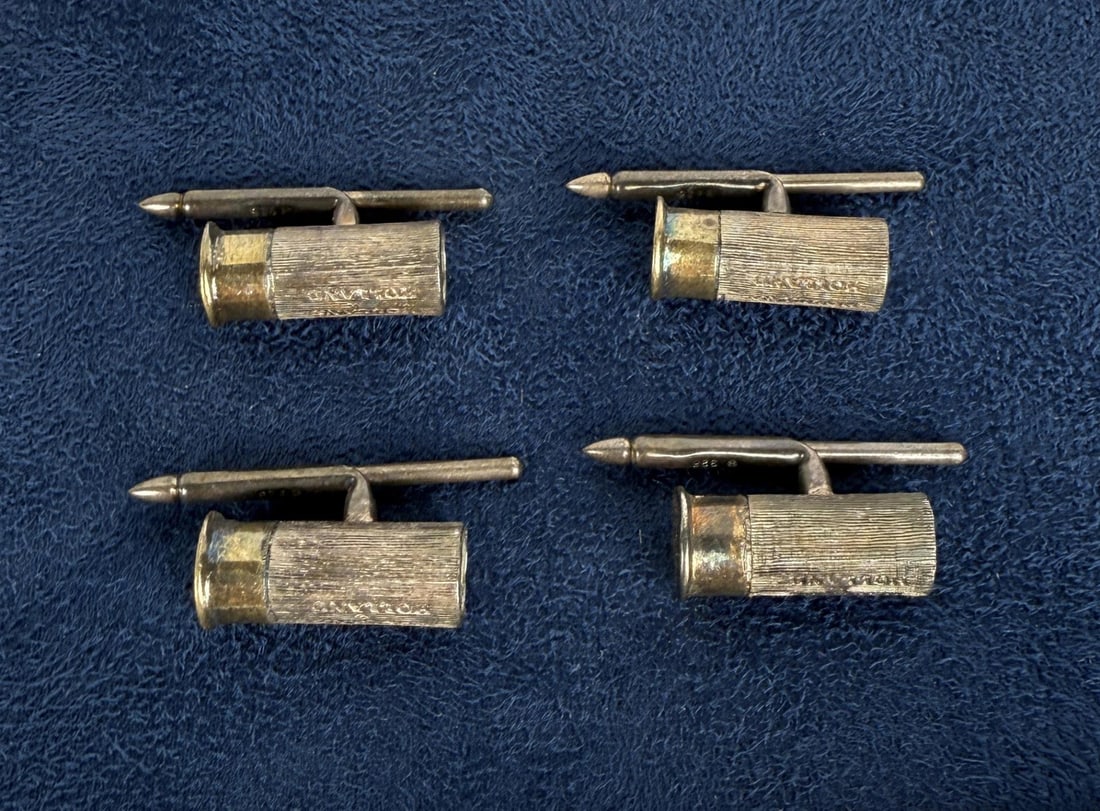 Holland & Holland Sterling Shotgun Shell Buttons: 25 grams.