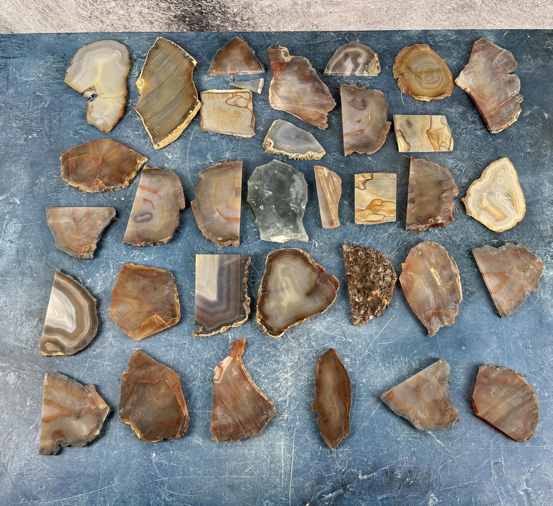 Collection Of Montana Agate Lapidary Slabs: 7.6 lbs total weight. Provenance: From the estate of Moosehead Gallery rock shop in Hamilton, Montana.