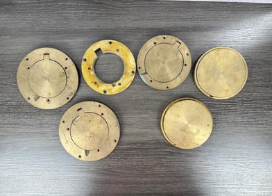 Group Of Hinged Brass Floor Plates