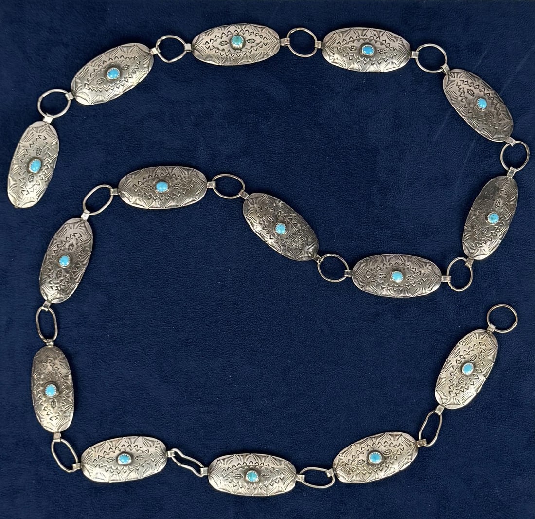 Navajo Sterling Silver Turquoise Concho Belt: 39 3/4" long overall. Conchos measure 1 3/4" long. 80.65 grams.