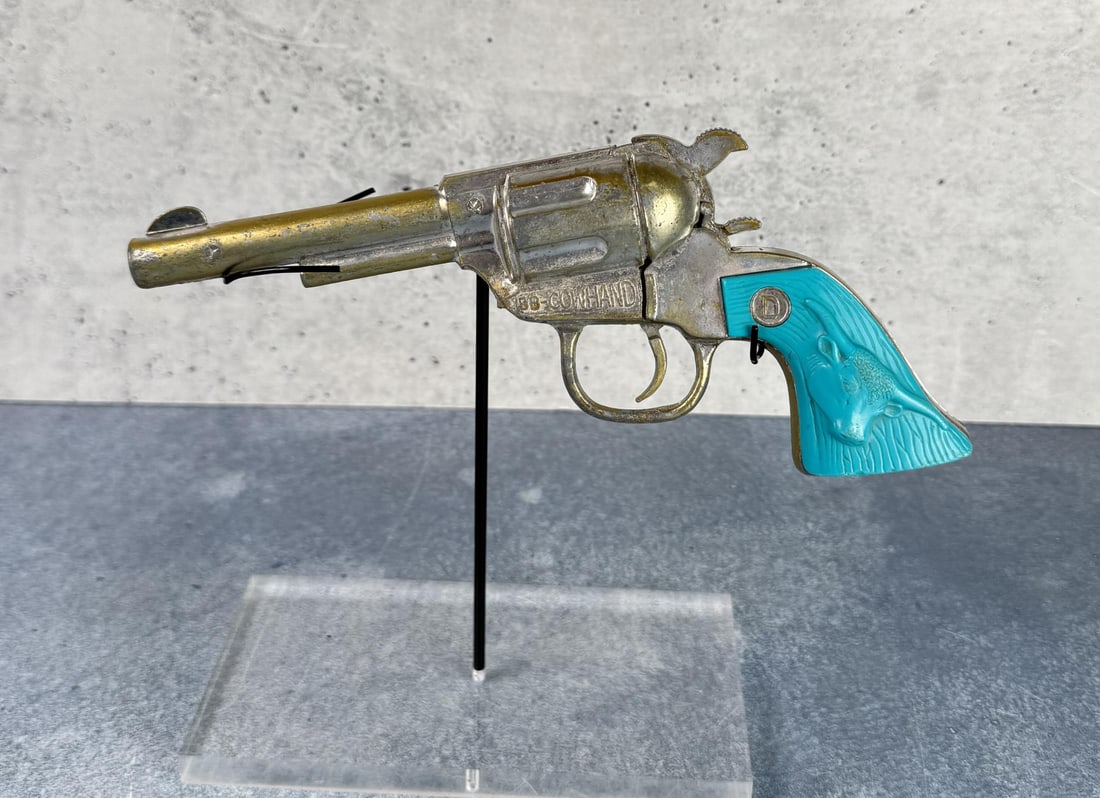 Buck 'N Bronc Cowhand Toy Cap Pistol: 9 1/4" by 3 3/8".