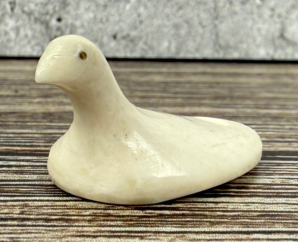 Thule Inuit Alaskan Tingmiujang Game Bird: Carved Walrus Material in the Form of a Snow Goose. 1 1/4" by 5/8". Native made prior to 1972. This item cannot be shipped to Oregon, California, Hawaii, New York, New Jersey, Internationally, or any 