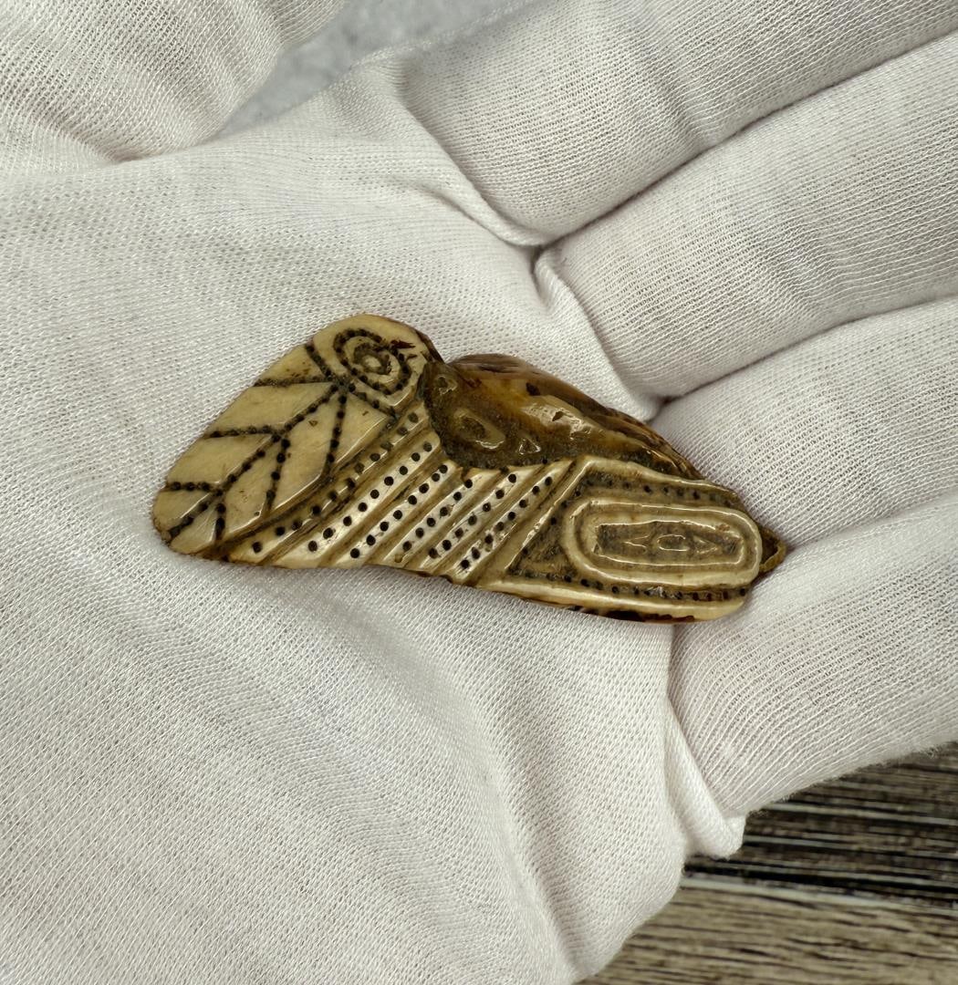 Alaskan Inuit Eskimo Pendant: 2 1/4" by 1 1/8". Carved walrus material. Native made prior to 1972. This item cannot be shipped to Oregon, California, Hawaii, New York, New Jersey, Internationally, or any other state that prohibits