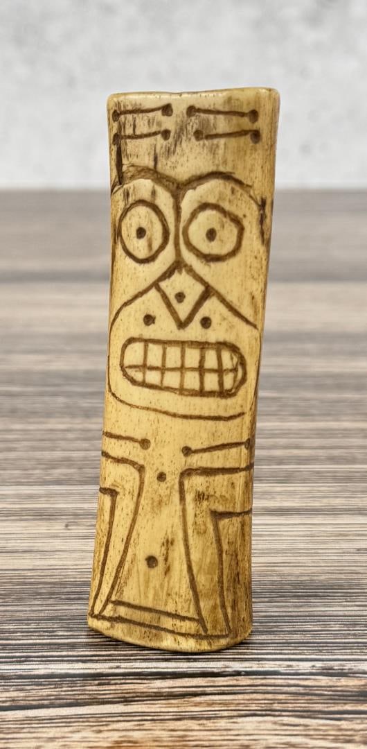 Carved Bone Amulet: Unknown culture, appears to be contemporary. 3 3/4" long.