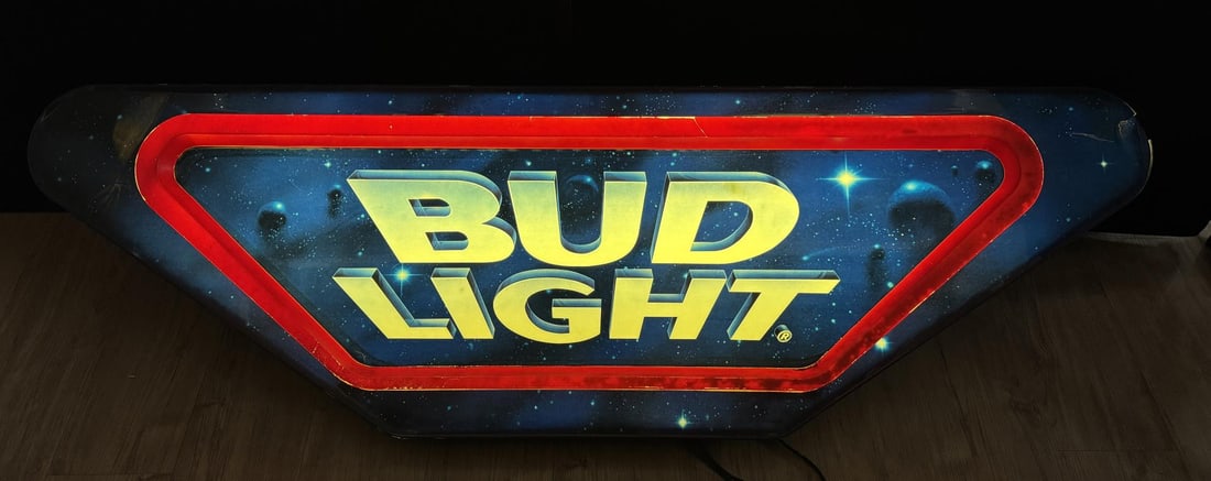 Bud Light Star Wars Lighted Sign: 63 1/2" by 20" by 12 1/2". One corner has damage. This lot requires Pickup at our Facility and is not Shippable.