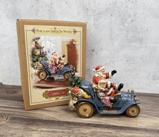Grandeur Noel Porcelain Santa on Wheels