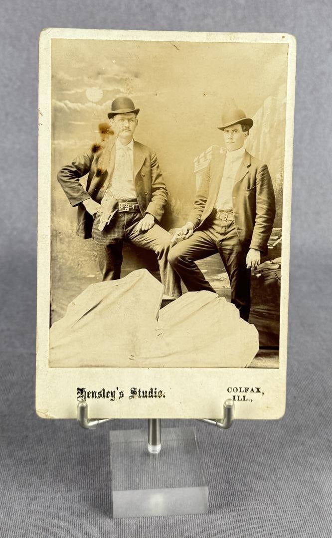Cabinet Photo of Gunfighters or Pinkertons: One has a gun belt on, the other is holding a revolver. Hensley's Studio Colfax Illinois