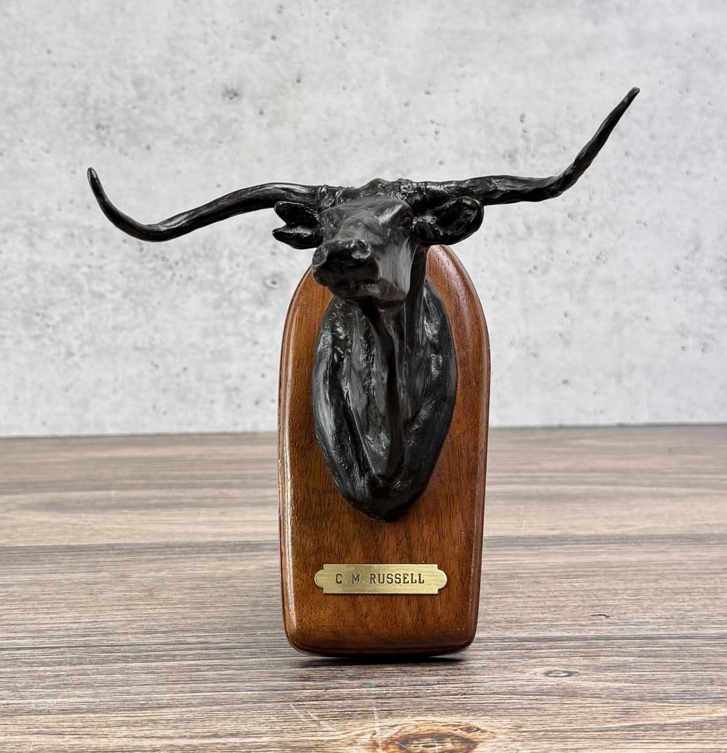 Charles M Russell Montana Steer Head Bronze: Signed CM Russell. Title is Steer Head. 6 5/8" by 6 1/4" by 5 1/2". 24/50 Powell Foundry. Charles Marion Russell (1864 - 1926) was active/lived in Montana, California, Missouri. Charles Russell is kno
