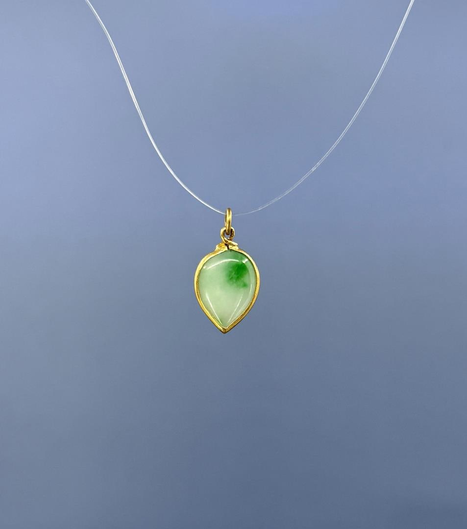 20k Gold Chinese Jade Pendant: 1.48 grams. 7/8" long.