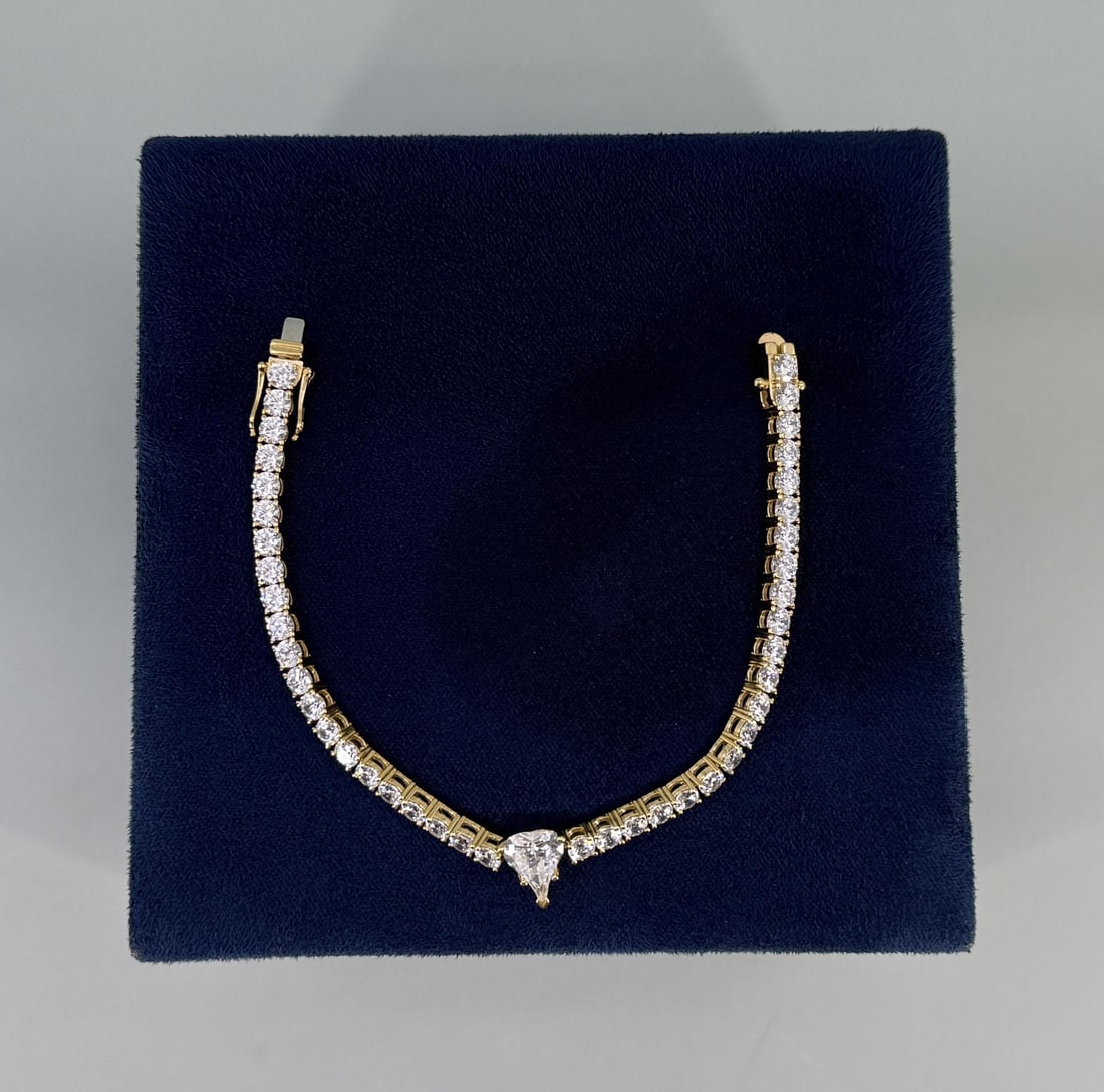 Sterling Silver CZ Tennis Bracelet: Nice example. 7 1/2" long. 15.76 grams.