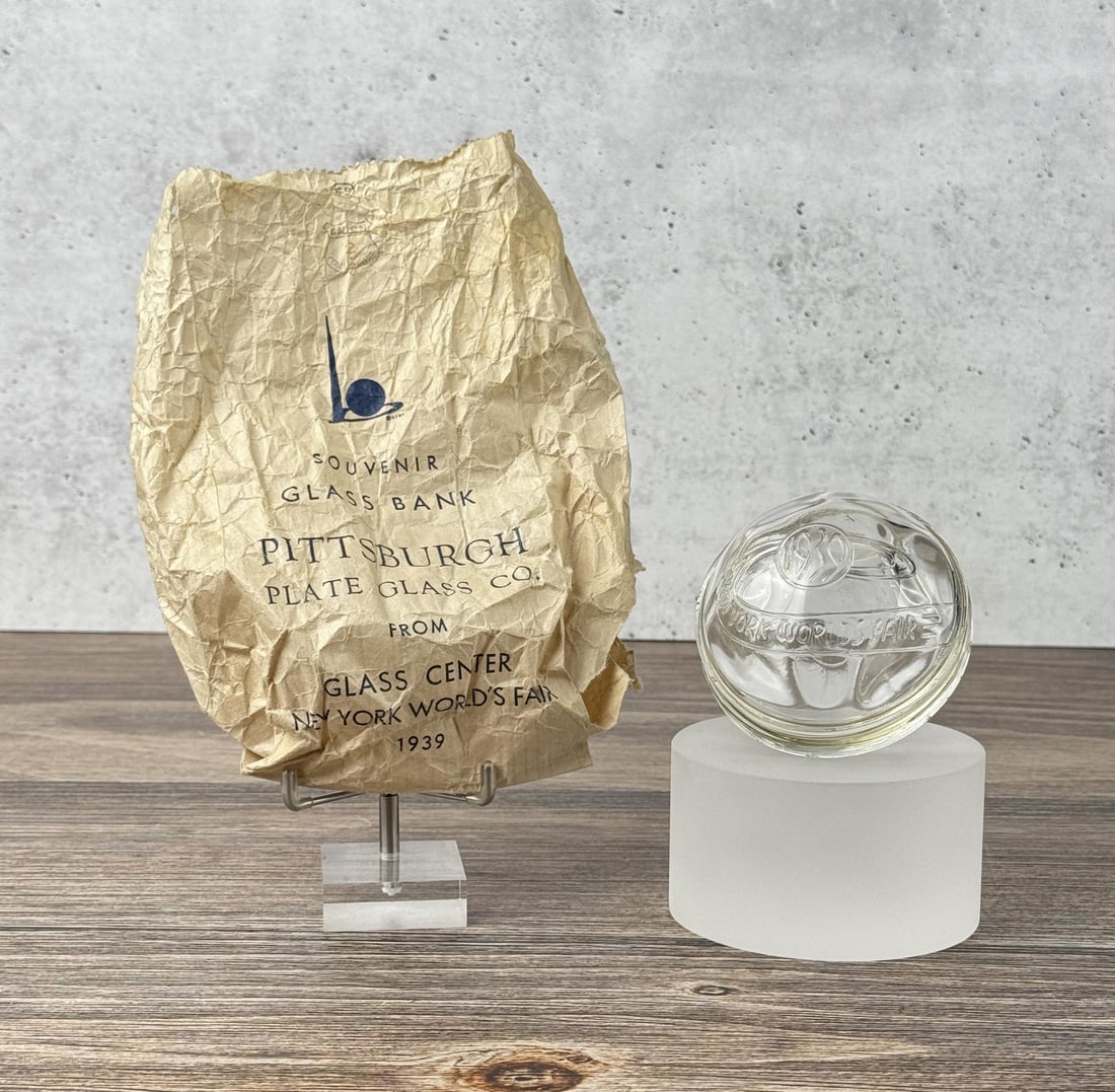 1939 Worlds Fair Souvenir Glass Bank: Has original bag. Pittsburgh Plate Glass Co. 3" diameter.