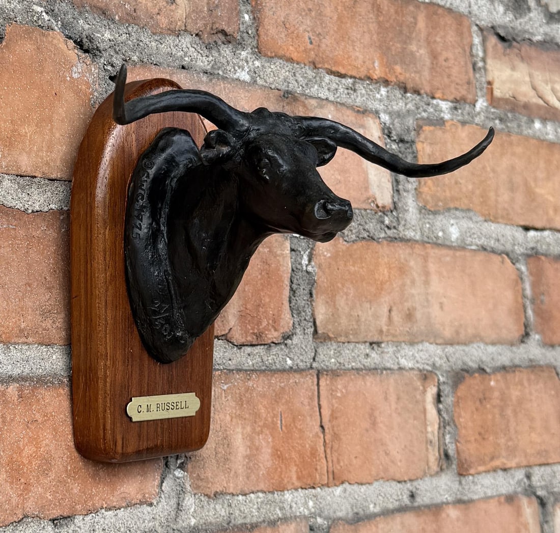 Charles M Russell Montana Steer Head Bronze: Signed CM Russell. Title is Steer Head. 6 5/8" by 6 1/4" by 5 1/2". CWC 1975 27/50 Powell Foundry. Charles Marion Russell (1864 - 1926) was active/lived in Montana, California, Missouri. Charles Russe