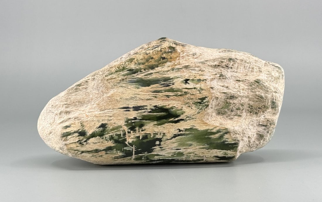 5355ct of New Zealand Pounamu Nephrite Jade: 1071 grams or 5355 Carats. 6 1/4" by 3 1/4" by 2 1/4".