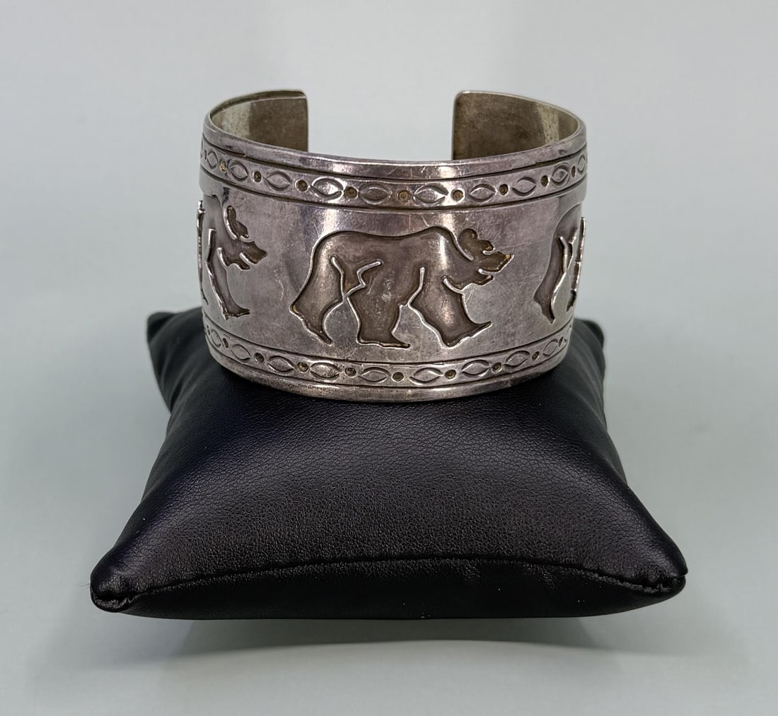 Rosco Scott Navajo Sterling Silver Bear Bracelet: 2 1/2" by 2" by 1 1/2". 69.1 grams.