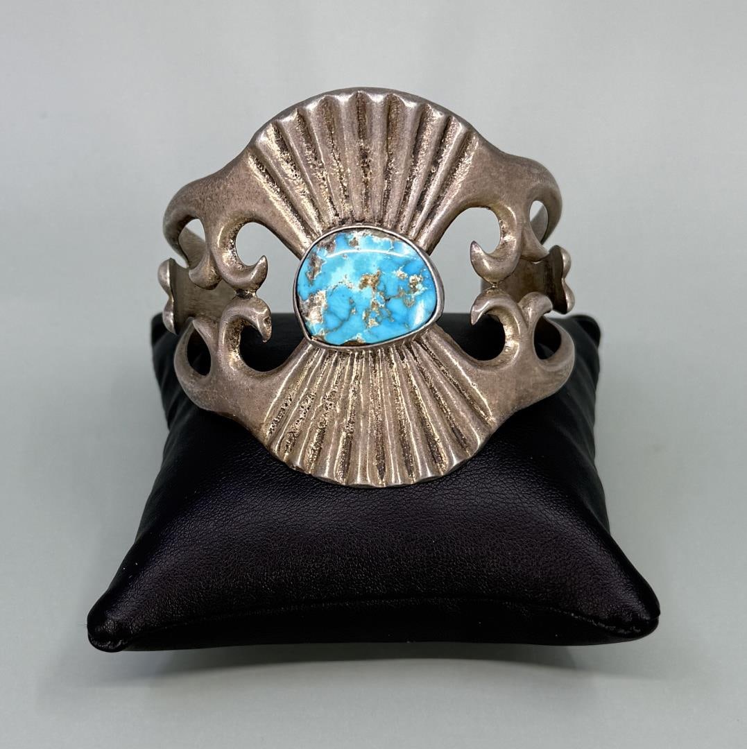 Navajo Sterling Tufa Cast Turquoise Bracelet: 2 3/4" by 2 1/4" by 2 1/8". 86.65 grams.