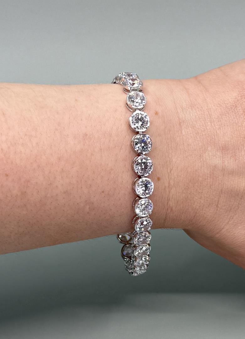 Charles Winston Sterling Silver CZ Bracelet: 8 1/2" long open. 23.58 grams.